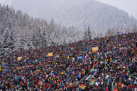 Spectators watch the men's 4x7.5-kilometer relay biathlon race at the 2026 Winter Olympics in Anterselva, Italy.