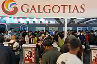 Day In Pics: February 18, 2026 | Photo: PTI : Visitors at Galgotias University's stall during the India AI Impact Summit 2026, in New Delhi. The University has been asked to vacate its stall at the AI Summit Expo immediately, sources said on Wednesday, amid a controversy over the display of a robotic dog that raised questions about the origin and ownership of the technology showcased.