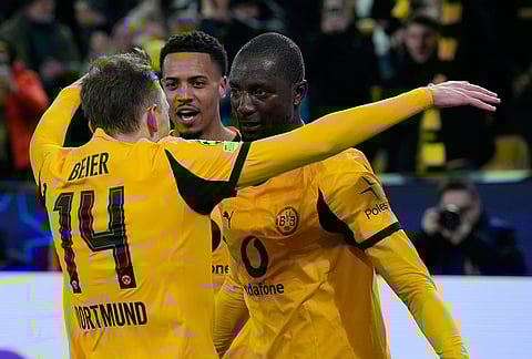 Dortmund's Maximilian Beier reacts after scoring during the Champions League knockout playoff first leg soccer match between Borussia Dortmund and Atalanta in Dortmund, Germany.