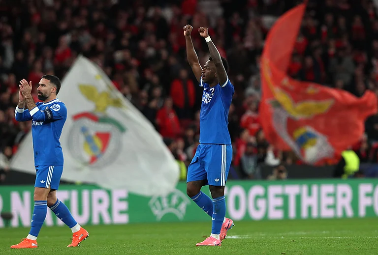 Real Madrid's Vinícius Júnior reacts at the end of a Champions League playoff soccer match between Benfica and Real Madrid in Lisbon, Portugal. - | Photoz: AP/Pedro Rocha