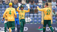 (AP Photo/Manish Swarup) : South Africa's Quinton de Kock, centre, celebrates with the bowler George Linde the wicket of United Arab Emirates' captain Muhammad Waseem during the T20 World Cup cricket match between South Africa and United Arab Emirates in New Delhi, India, Wednesday, Feb. 18, 2026.