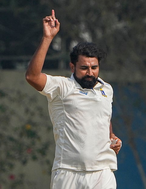 Bengal's Mohammed Shami celebrates the wicket of Jammu and Kashmir's Shubham Pundir during the fourth day of the Ranji Trophy semifinal cricket match between Jammu and Kashmir and Bengal, at the Bengal Cricket Academy Ground, in Kalyani, West Bengal.
