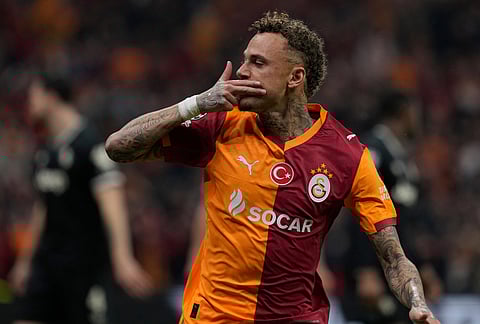 Galatasaray's Noa Lang celebrates after scoring his side's second goal during a Champions league play-off first leg soccer match between Galatasaray and Juventus, in Istanbul, Turkey.