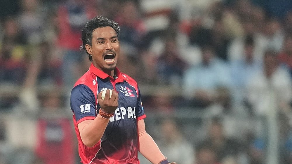Nepal's Sompal Kami celebrates the wicket of Scotland's Brandon McMullen during the T20 World Cup cricket match between Nepal and Scotland in Mumbai. - | Photo: AP/Rafiq Maqbool