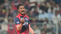 | Photo: AP/Rafiq Maqbool : Nepal's Sompal Kami celebrates the wicket of Scotland's Brandon McMullen during the T20 World Cup cricket match between Nepal and Scotland in Mumbai.
