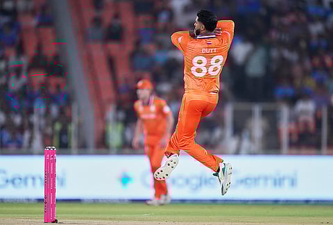 Netherlands' Aryan Dutt bowls a delivery during the T20 World Cup cricket match between India and Netherlands in Ahmedabad.