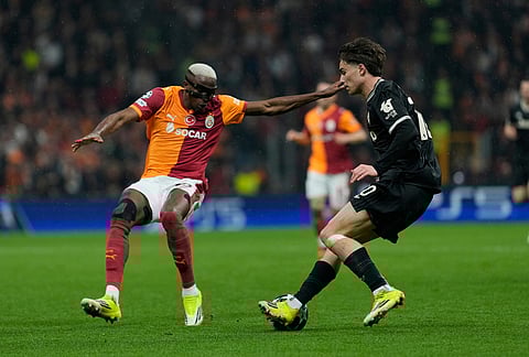 Galatasaray's Victor Osimhen, left, defends against Juventus' Kenan Yildiz during a Champions league play-off first leg soccer match between Galatasaray and Juventus, in Istanbul, Turkey.