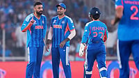 Photo: AP : India's Varun Chakravarthy, left, celebrates with teammates the wicket of Netherlands' Max O'Dowd during the T20 World Cup match between India and Netherlands in Ahmedabad.