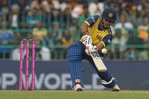 Sri Lanka's Dunith Wellalage plays a shot during the T20 World Cup cricket match between Sri Lanka and Zimbabwe in Colombo, Sri Lanka.