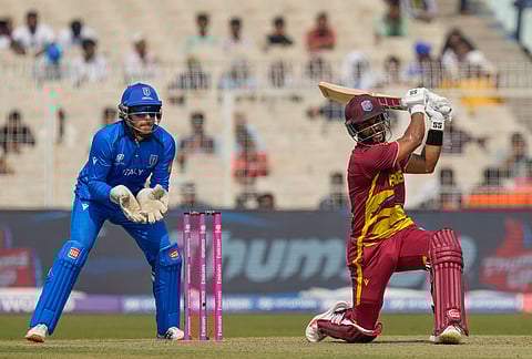 West Indies' captain Shai Hope hits a six during the T20 World Cup cricket match between West Indies and Italy in Kolkata.