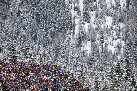 Spectators wait for the start of the women's 4x6-kilometer relay biathlon race at the 2026 Winter Olympics in Anterselva, Italy.