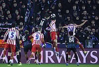 | Photo: AP/Omar Havana : Atletico Madrid's Marc Pubill, centre right, and Brugge's Bjorn Meijer, centre top, challenge for the ball during the Champions League play-off first leg soccer match between Club Brugge and Atletico Madrid, in Bruges, Belgium.