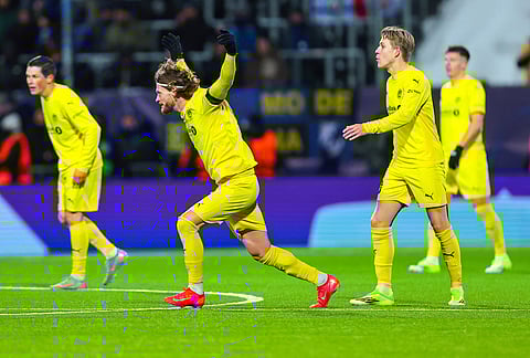 Bodø/Glimt's Kasper Høgh celebrates after scoring against Inter Milan during a Champions League soccer match in Bodo, Norway. 