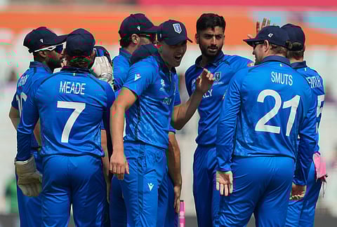 Italy players celebrate the wicket of West Indies' Brandon King during the T20 World Cup cricket match between West Indies and Italy in Kolkata.