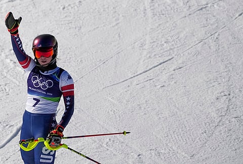 United States' Mikaela Shiffrin celebrates winning an alpine ski, women's slalom race, at the 2026 Winter Olympics, in Cortina d'Ampezzo, Italy.