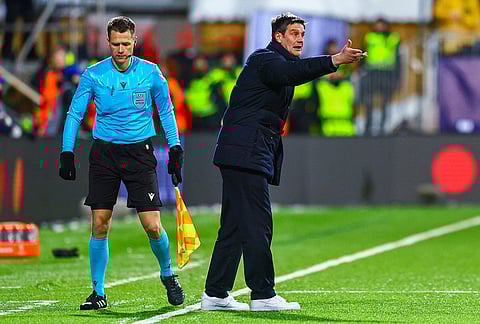 Inter Milan head coach Cristian Chivu directs his team during a Champions League soccer match against Bodø/Glimt in Bodo, Norway. 