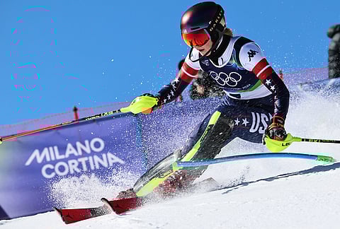 United States' Mikaela Shiffrin speeds down the course during an alpine ski, women's slalom race, at the 2026 Winter Olympics, in Cortina d'Ampezzo, Italy.