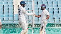 PTI : Karnataka's Kruthik Krishna, right, celebrates his half century during day four of the Ranji Trophy semi-final against Uttarakhand, at Ekana Cricket Stadium in Lucknow.