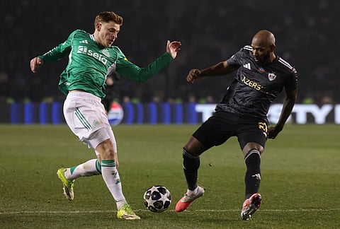 Newcastle's Harvey Barnes, left, fights for the ball with Qarabag's Kevin Medina during the Champions League play-off first leg soccer match between Qarabag and Newcastle in Baku, Azerbaijan.