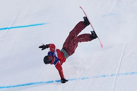 Canada's Mark McMorris crashes during the men's snowboarding slopestyle finals at the 2026 Winter Olympics, in Livigno, Italy.