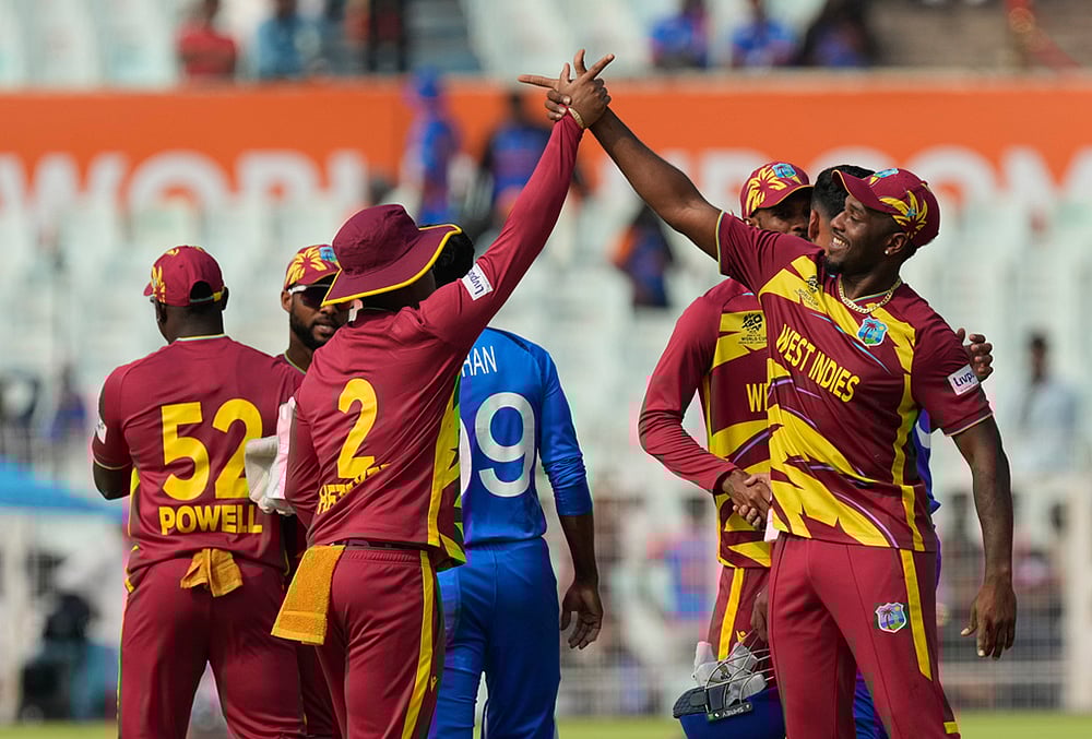 West Indies players celebrate after they won the T20 World Cup cricket match against Italy in Kolkata. - | Photo: AP/Bikas Das