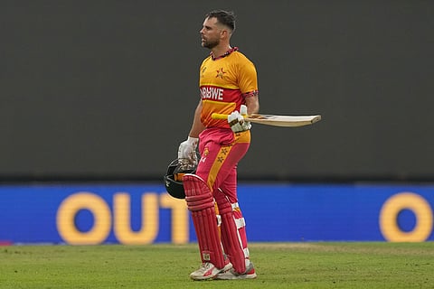 Zimbabwe's Ryan Burl leaves the ground after losing his wicket during the T20 World Cup cricket match between Sri Lanka and Zimbabwe in Colombo, Sri Lanka.