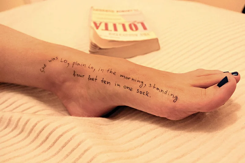 A photo of a woman’s foot with a quote from Vladimir Nabokov’s novel Lolita