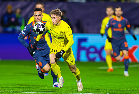 Bodø/Glimt's Fredrik Sjøvold and Inter Milan's Lautaro Martínez, left, vie for the ball during a Champions League soccer match in Bodo, Norway.