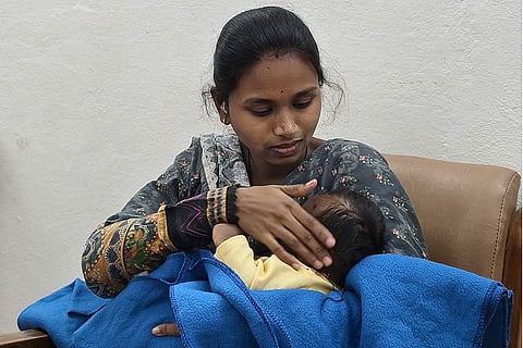 Shital Chandrakant Chitte carries her 10-day-old baby while appearing for her Class 12 Maharashtra board examination, in Nanded, Maharashtra. The incident prompted authorities to set up a special mother-friendly facility, 'Matrusneh Kaksha', at the exam centre.