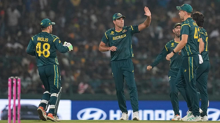 Australia's players celebrate the wicket of Sri Lanka's Kusal Perera during their T20 World Cup match in Pallekele. - AP