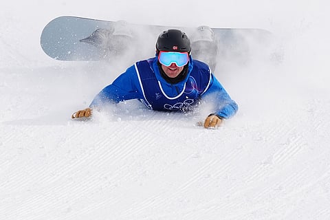 Norway's Mons Roisland crashes during the men's snowboarding slopestyle finals at the 2026 Winter Olympics, in Livigno, Italy.