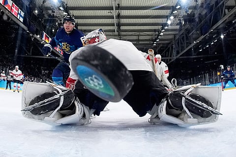 Finland's Artturi Lehkonen (62) scores his side's third goal during a men's ice hockey quarterfinal game between Finland and Switzerland at the 2026 Winter Olympics, in Milan, Italy.