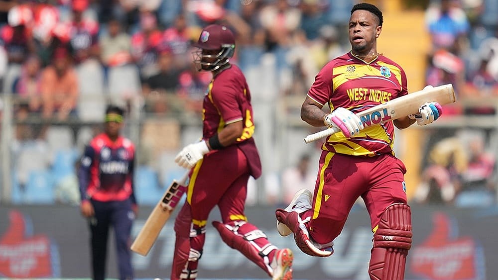West Indies' Shimron Hetmyer, right and captain Shai Hope run between the wickets to score during the T20 World Cup cricket match between Nepal and West Indies in Mumbai. - | Photo: AP/Rafiq Maqbool