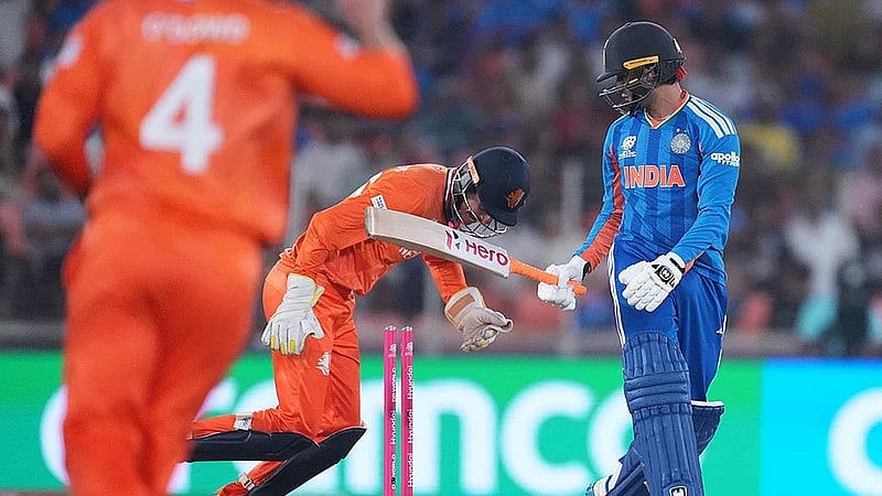 Photo: AP/Ajit Solanki : India's Abhishek Sharma, right, reacts after getting bowled out by Netherlands' Aryan Dutt during the T20 World Cup cricket match between India and Netherlands in Ahmedabad. 