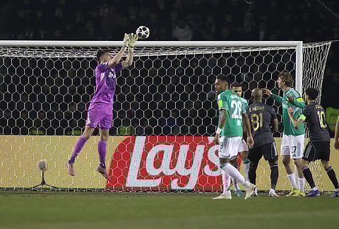 Newcastle's goalkeeper Nick Pope makes a save during the Champions League play-off first leg soccer match between Qarabag and Newcastle in Baku, Azerbaijan.