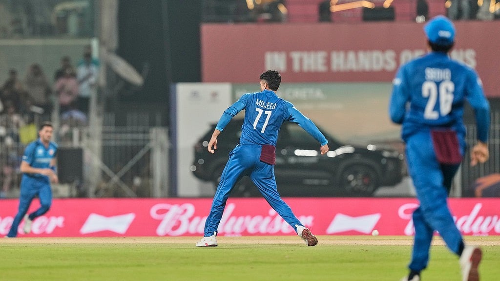 Afghanistan's Mujeeb Ur Rahman celebrates the wicket of Canada's captain Dilpreet Bajwa during the T20 World Cup cricket match between Afghanistan and Canada in Chennai, India, Thursday, Feb. 19, 2026. - AP Photo/Mahesh Kumar A.