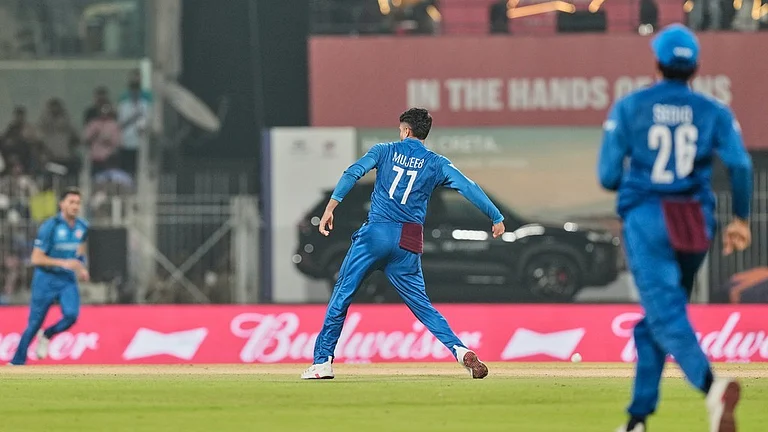 Afghanistan's Mujeeb Ur Rahman celebrates the wicket of Canada's captain Dilpreet Bajwa during the T20 World Cup cricket match between Afghanistan and Canada in Chennai, India, Thursday, Feb. 19, 2026. - AP Photo/Mahesh Kumar A.