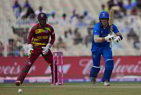 Italy's Harry Manenti plays a shot during the T20 World Cup cricket match between West Indies and Italy in Kolkata.