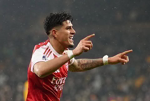 Arsenal's Piero Hincapie celebrates after scoring his side the second goal during the Premier League soccer match between Wolverhampton Wanderers and Arsenal in Wolverhampton, England.