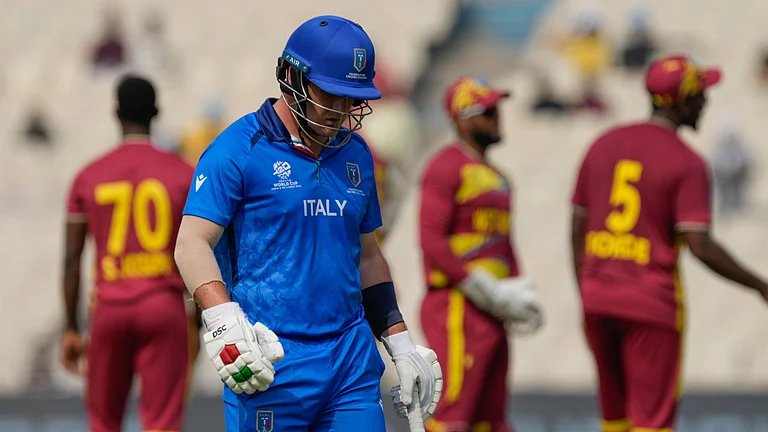 Italy's Harry Manenti leaves the ground after losing his wicket during the T20 World Cup cricket match between West Indies and Italy in Kolkata, India, Thursday, Feb. 19, 2026. - (AP Photo/Bikas Das)