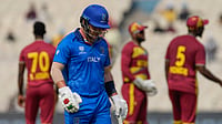 (AP Photo/Bikas Das) : Italy's Harry Manenti leaves the ground after losing his wicket during the T20 World Cup cricket match between West Indies and Italy in Kolkata, India, Thursday, Feb. 19, 2026. 