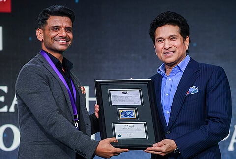 Indian astronaut and IAF Group Captain Shubhanshu Shukla, left, felicitate cricket legend Sachin Tendulkar during a climate change event, in Mumbai, Maharashtra.