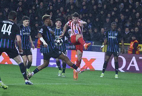 Atletico Madrid's Matteo Ruggeri, centre right, shoots the ball during the Champions League play-off first leg soccer match between Club Brugge and Atletico Madrid, in Bruges, Belgium.