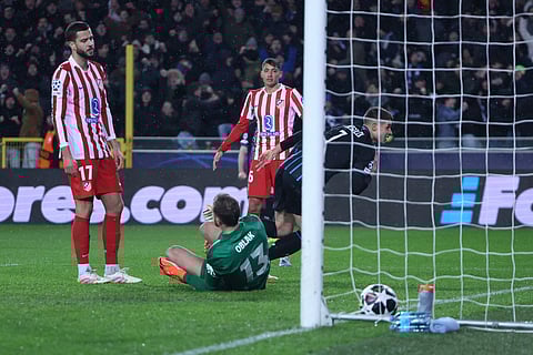 Brugge's Nicolo Tresoldi, right, celebrates after scoring his side's second goal during the Champions League play-off first leg soccer match between Club Brugge and Atletico Madrid, in Bruges, Belgium.