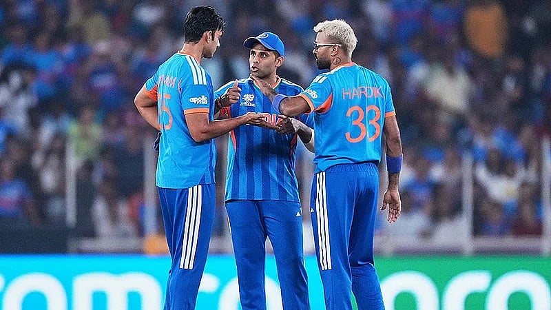 Shivam Dube, left, captain Suryakumar Yadav and Hardik Pandya have a chat during the T20 World Cup match between India and Netherlands in Ahmedabad. - AP