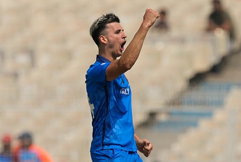 Italy's Thomas Draca celebrates the wicket of West Indies' Shimron Hetmyer during the T20 World Cup cricket match between West Indies and Italy in Kolkata.