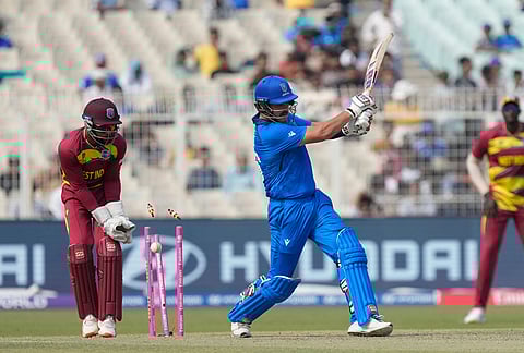 Italy's Benjamin Manenti bowled out by West Indies' Gudakesh Motie during the T20 World Cup cricket match between West Indies and Italy in Kolkata.