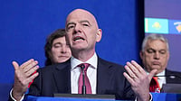  (AP Photo/Evan Vucci) : FIFA President Gianni Infantino, center left, applauds after President Donald Trump delivered an address during a meeting of Global Business Leaders at the Annual Meeting of the World Economic Forum in Davos, Switzerland, Wednesday, Jan. 21, 2026.