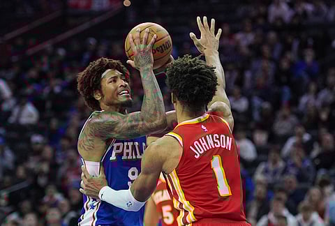 Philadelphia 76ers' Kelly Oubre Jr. (9) goes to shoot against Atlanta Hawks' Jalen Johnson during the second half of an NBA basketball game in Philadelphia.