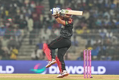 Canada's Harsh Thaker plays a shot during the T20 World Cup cricket match between Afghanistan and Canada in Chennai.